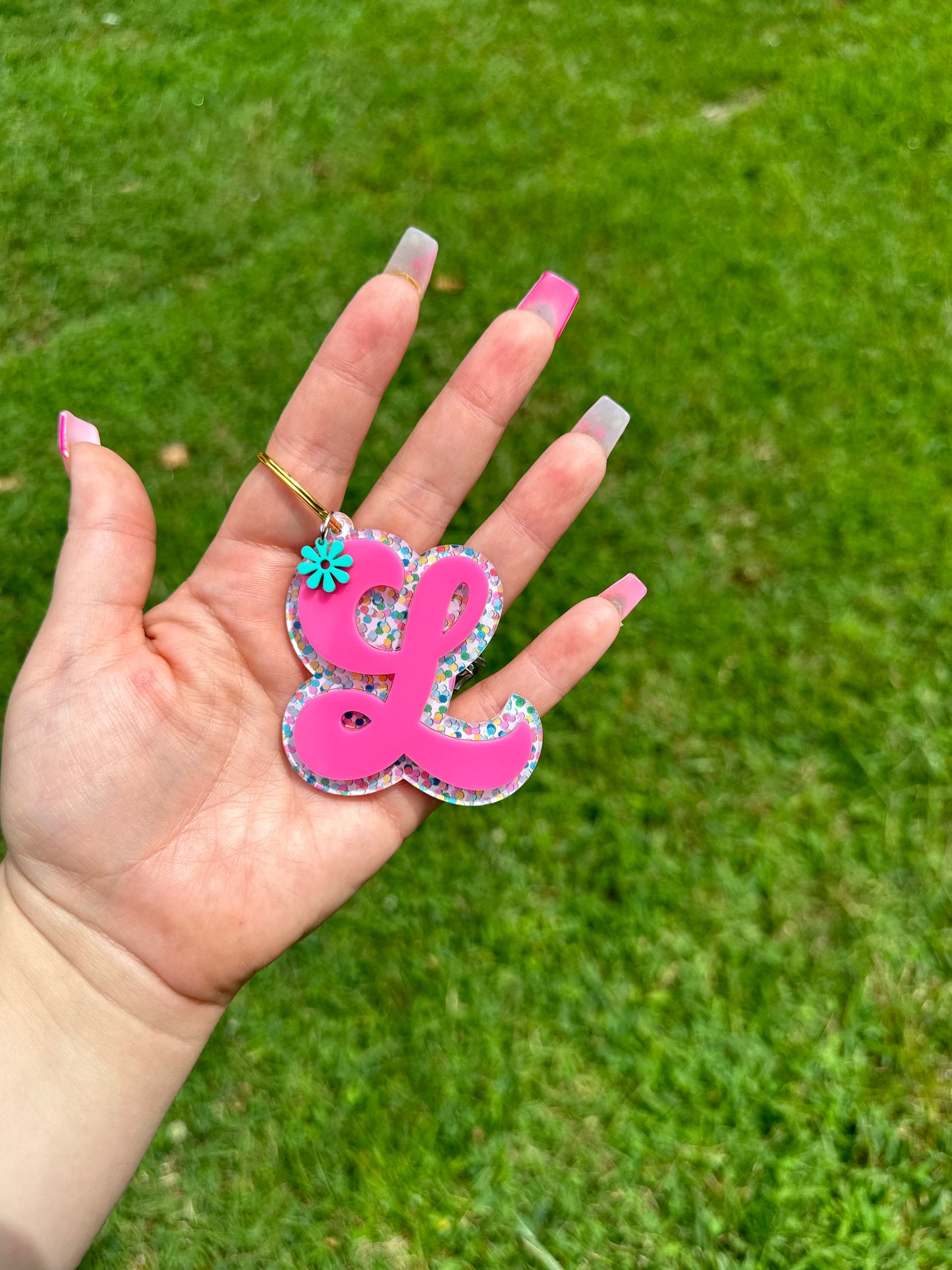 Initial bag tag with flower charm